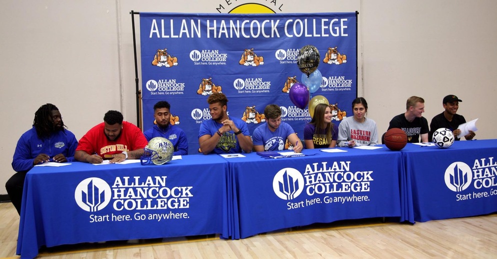 Nine Hancock Student-Athletes Sign Scholarships with Four-Year Universities