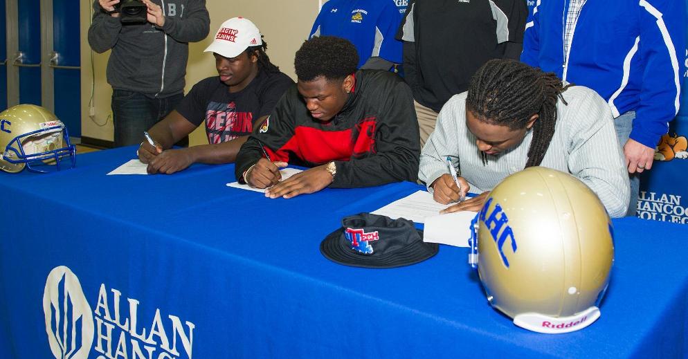 Three Hancock Football Players Sign with Division I Programs